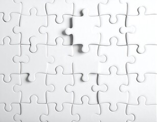 A white jigsaw puzzle with one piece missing