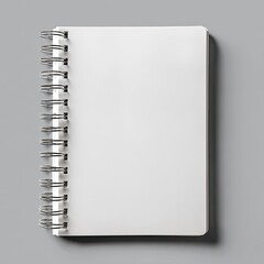 Blank spiral-bound notebook on gray background