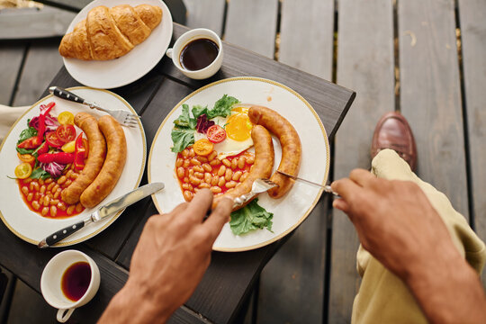 Delicious breakfast spread enjoyed by a young camper in a cozy cabin setting - Powered by Adobe