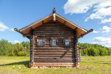 Rustic Wooden Village House with Carved Window Frames