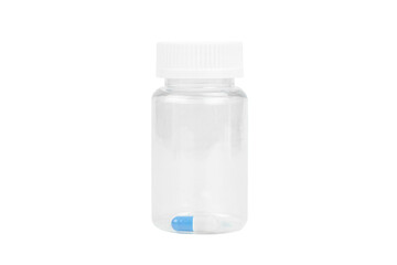 One blue and white capsule in a clear transparent plastic pill bottle. Concept of final dose or precision medicine, isolated on white background with clipping path.