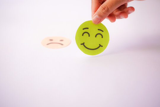 Hand selected happy smiley face paper cut, good feedback rating and positive customer review, experience, satisfaction survey ,mental health positive life concept.