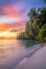 Obraz premium Tropical beach at sunset with palm trees and colorful sky reflected in the water