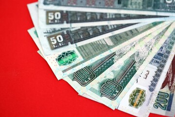 Egyptian pound money bills in big amount on red. Finance and banking concept