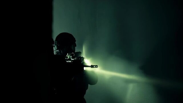 Group of special forces soldiers with weapons and flashlights conducting a mission in a tactical operation, military training footage.