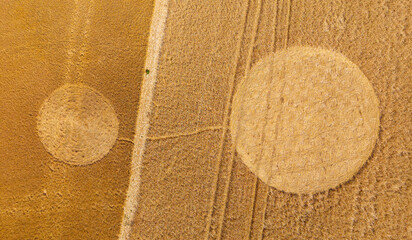Aerial view of a mysterious, intricate, geometric crop art, crop circle formation in a wheat field near Somerton, Somerset, England, UK 