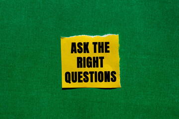 Ask The Right Questions message written on ripped torn yellow paper piece on green background. Conceptual Ask The Right Questions symbol. Copy space.