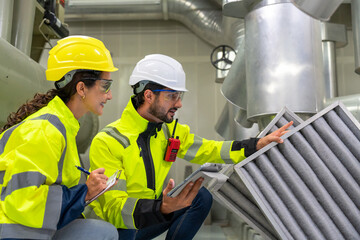 Construction site with technicians discussing HVAC control, equipment repairs, and safety protocols in industry settings.