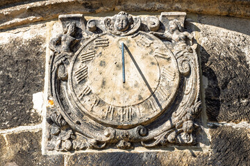 Ancient Stone Sundial with Roman Numerals