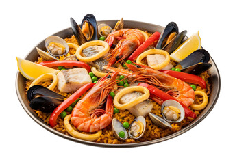 Overhead shot of paella with shrimp mussels squid rings peppers peas fish clams and lemon wedges in a pan on white or transparent background