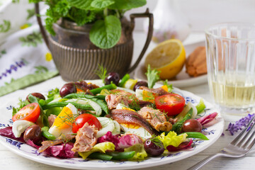 Mediterranean Tuna Salad. Nicoise Salad. White wooden background
