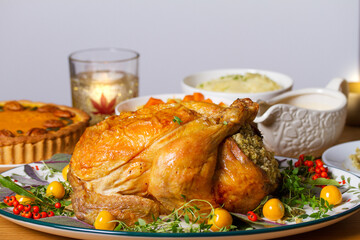 Celebration of Thanksgiving Day. Roasted chicken or turkey, mashed potatoes, vegetables and pumpkin pie. White background with copy space
