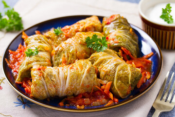 Stuffed cabbage leaves. Cabbage wraps. Chou farci, dolma, sarma, golubtsy or golabki