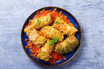 Stuffed cabbage leaves. Cabbage wraps. Chou farci, dolma, sarma, golubtsy or golabki. View from above, top studio shot
