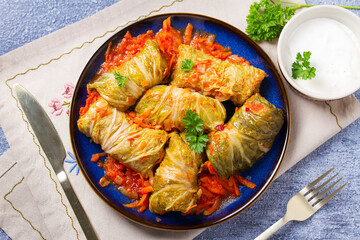 Stuffed cabbage leaves. Cabbage wraps. Chou farci, dolma, sarma, golubtsy or golabki. View from above, top studio shot
