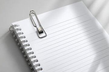 Spiral notebook with paper clip closeup