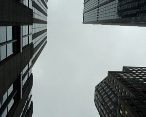 Modern skyscraper buildings against a cloudy sky
