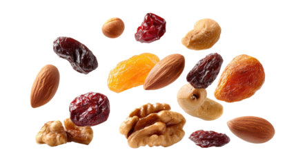 A mix of nuts and dried fruits on a white isolated background.