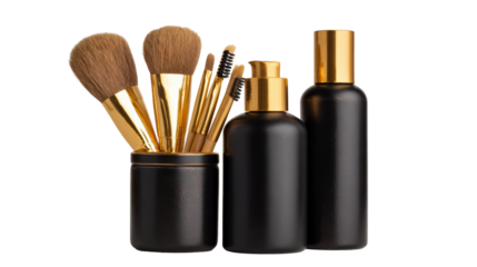 Makeup brushes and bottles in sleek black and gold on a white background.