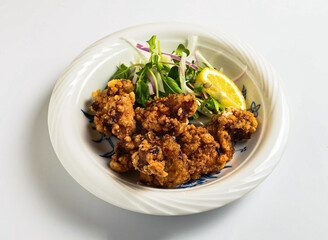 Crispy Japanese Karaage Fried Chicken in bowl side view of japanese food