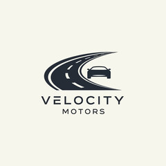 A modern logo for Velocity Motors featuring a car silhouette on a winding road.