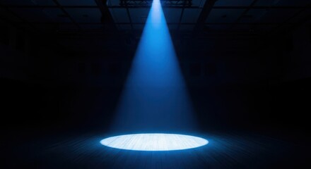 A Single Blue Spotlight Illuminates the Dark Stage