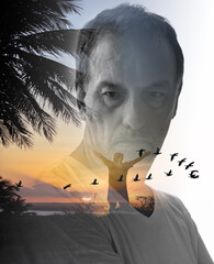 Double exposure portrait of an adult male with serious expression merged with tropical sunset