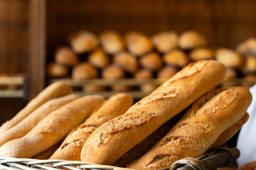 Fresh baguette bread baking in artisan bakery shop