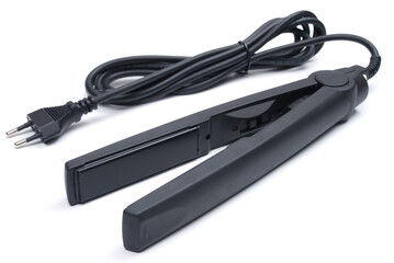 Black eletronic hair iron straightener on white background