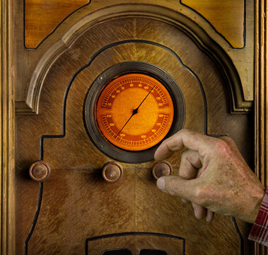 Vintage radio being tuned to a station