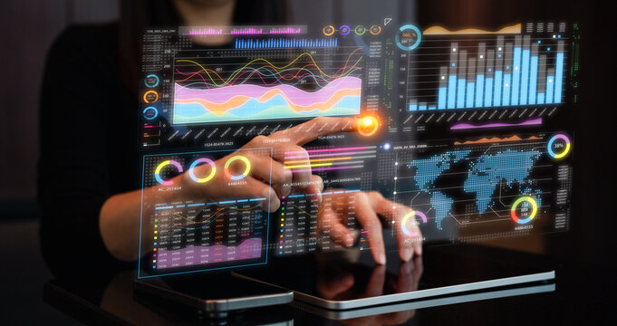 A person interacts with a high-tech digital interface displaying colorful data visualizations and analytics. - Powered by Adobe