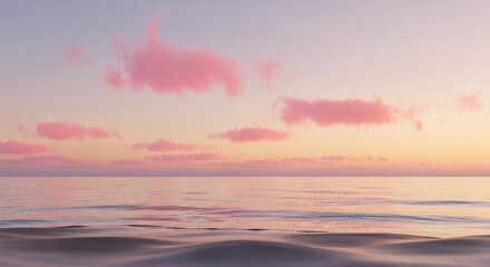 Fototapeta premium Gentle ocean waves reflect soft pink clouds at sunrise, creating a serene and tranquil seascape.