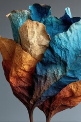 Vibrant dried leaves in striking blue and warm earth tones create a stunning abstract natural art composition