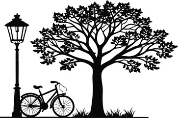 Silhouette of a bicycle under a large tree next to a lamp post