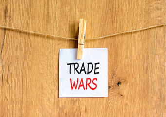 Trade wars symbol. Concept word Trade wars on beautiful white paper. Beautiful wooden clothespin....