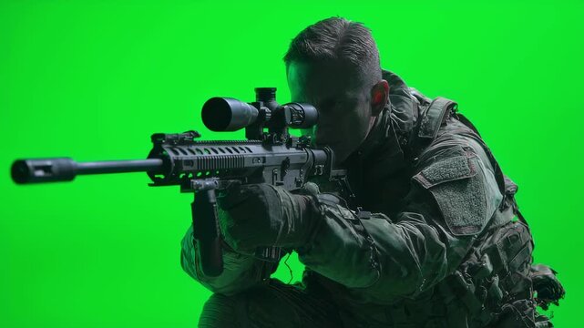 Military marksman in quiet moment adjusting precision scope exhaling slowly green screen isolated for dynamic inserts in action films or documentaries.