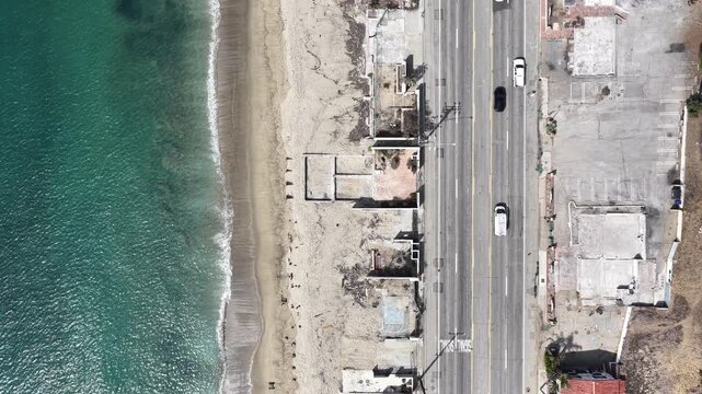 Aerial drone shot from above of the L.A. fires that burnt and damaged homes along PCH in Malibu Los Angeles, California.