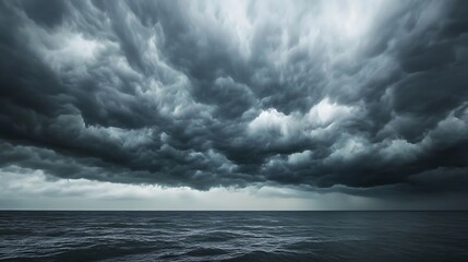 Obraz premium Dramatic storm clouds over turbulent ocean waves powerful nature photography