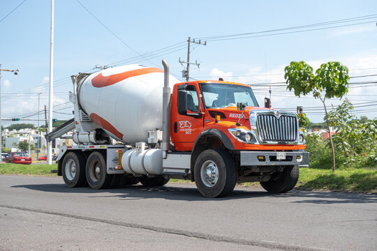 white and orange concrete mixer trucks, Holcim Apasco, Guadalajara, jalisco, Mexico, October 2, 2024.