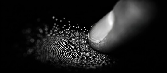 Close-up of a finger touching a digital fingerprint sensor