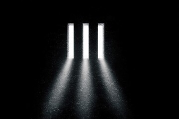 Naklejka premium Three illuminated windows in a dark cell
