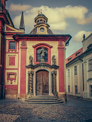 Obraz premium Beautiful view of ancient buildings and red roofs in Prague, Czech Republic