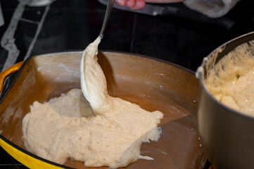 Pouring Liquid Dough into Ceramic Baking Dish