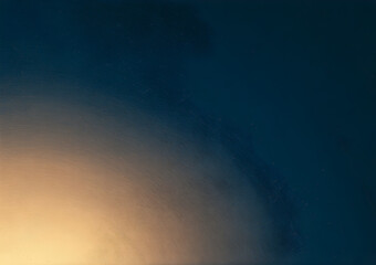 Fototapeta premium Close-up view of a hazy, diffused light source against a dark background.