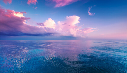 Fototapeta premium Pastel Clouds Over Calm Ocean Water Pink Clouds Purple Clouds