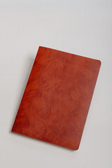 Brown Leather-Look Notebook Closed on White Surface
