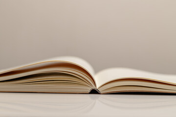Side View close up of Open Notebook Showing Curved Pages