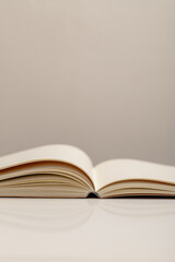 Side View close up of Open Notebook Showing Curved Pages