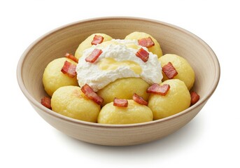 Slovak Bryndzov&eacute; Halu&scaron;ky Dumplings with Cheese and Bacon in a wooden bowl.
