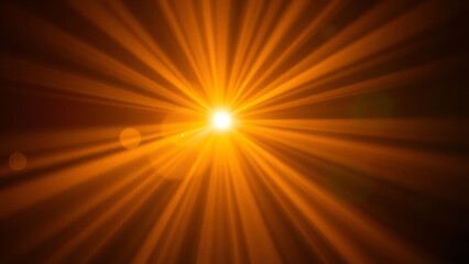 Dramatic golden light beams shining through darkness, creating an abstract bokeh effect.